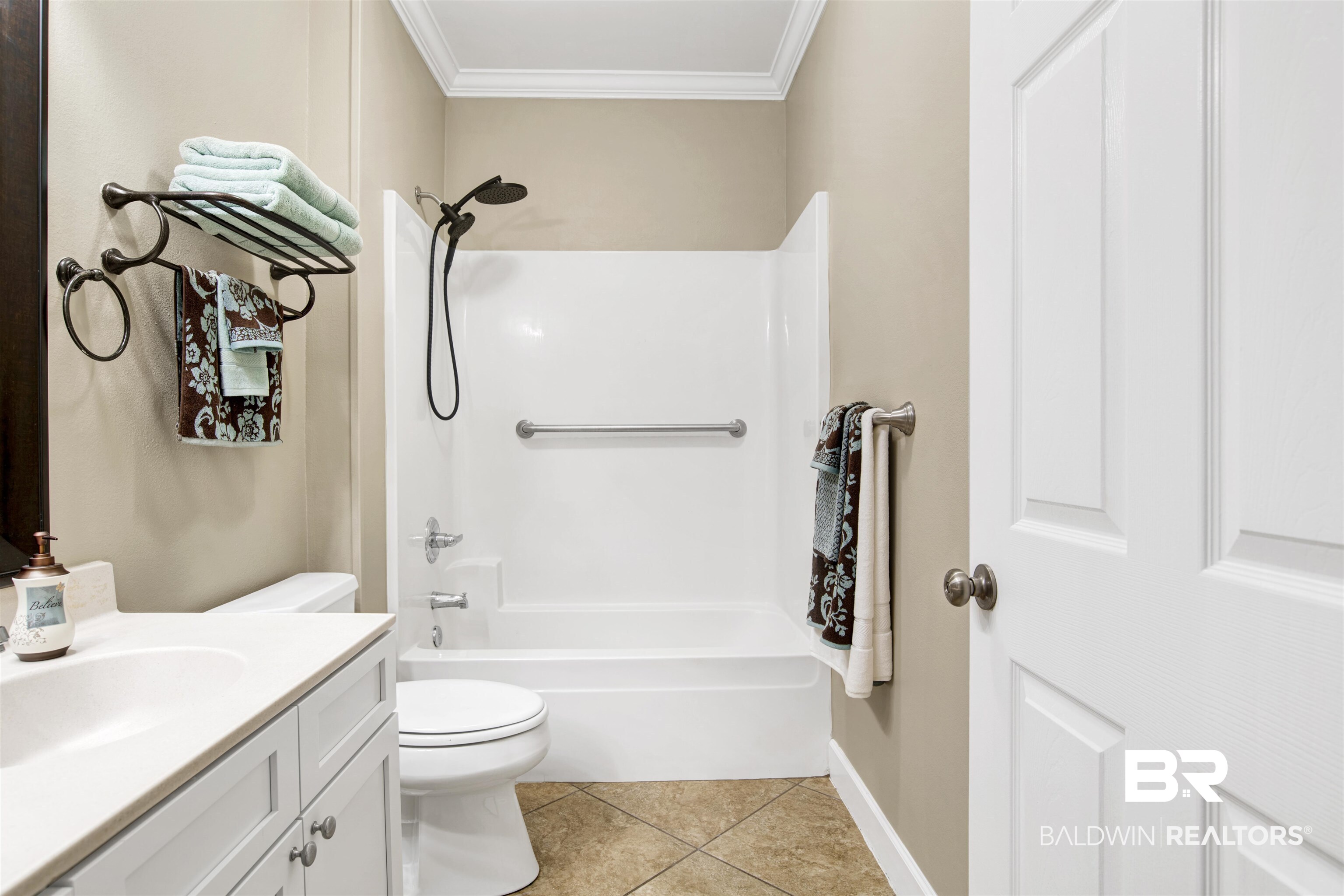 450 Park Avenue, Unit 202 Foley, AL 36535 - Photo 8 of 18 Bathroom with light tile patterned flooring, shower / bathtub combination, vanity, and ornamental molding