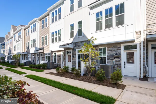 a front view of a building with garden