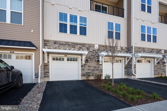 a front view of a house with yard
