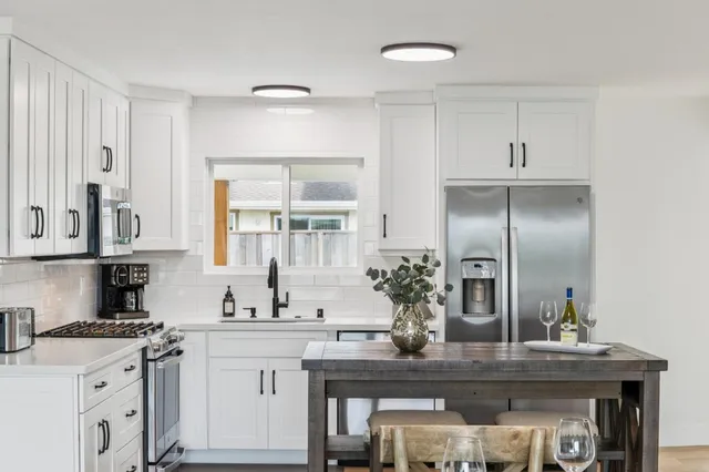 a bedroom with a large bed and a flat screen tv