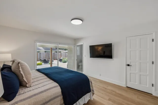 a view of hallway with wooden floor