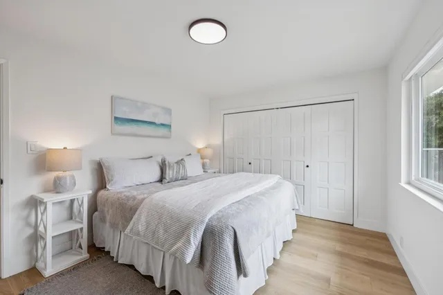 a view of a dining room with furniture and window
