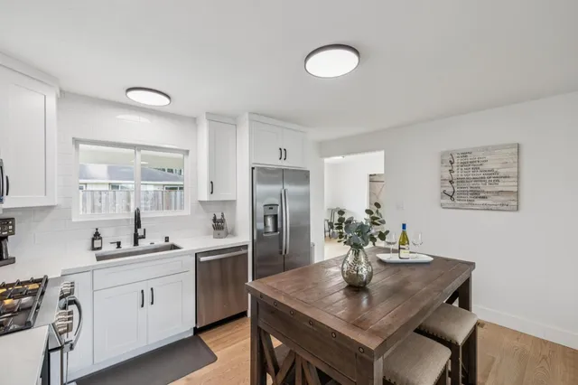 a view of a livingroom with furniture and window