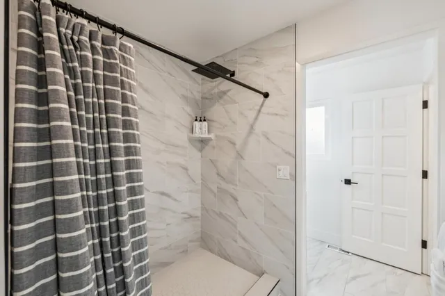 a backyard of a house with outdoor seating