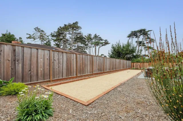 a view of a backyard with sitting area