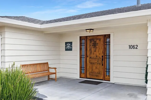 a front view of house with yard and seating area