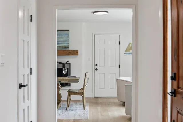 a view of a dining room with furniture and a fireplace