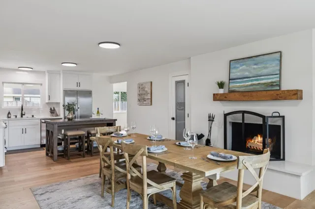 a open dining room with furniture and window