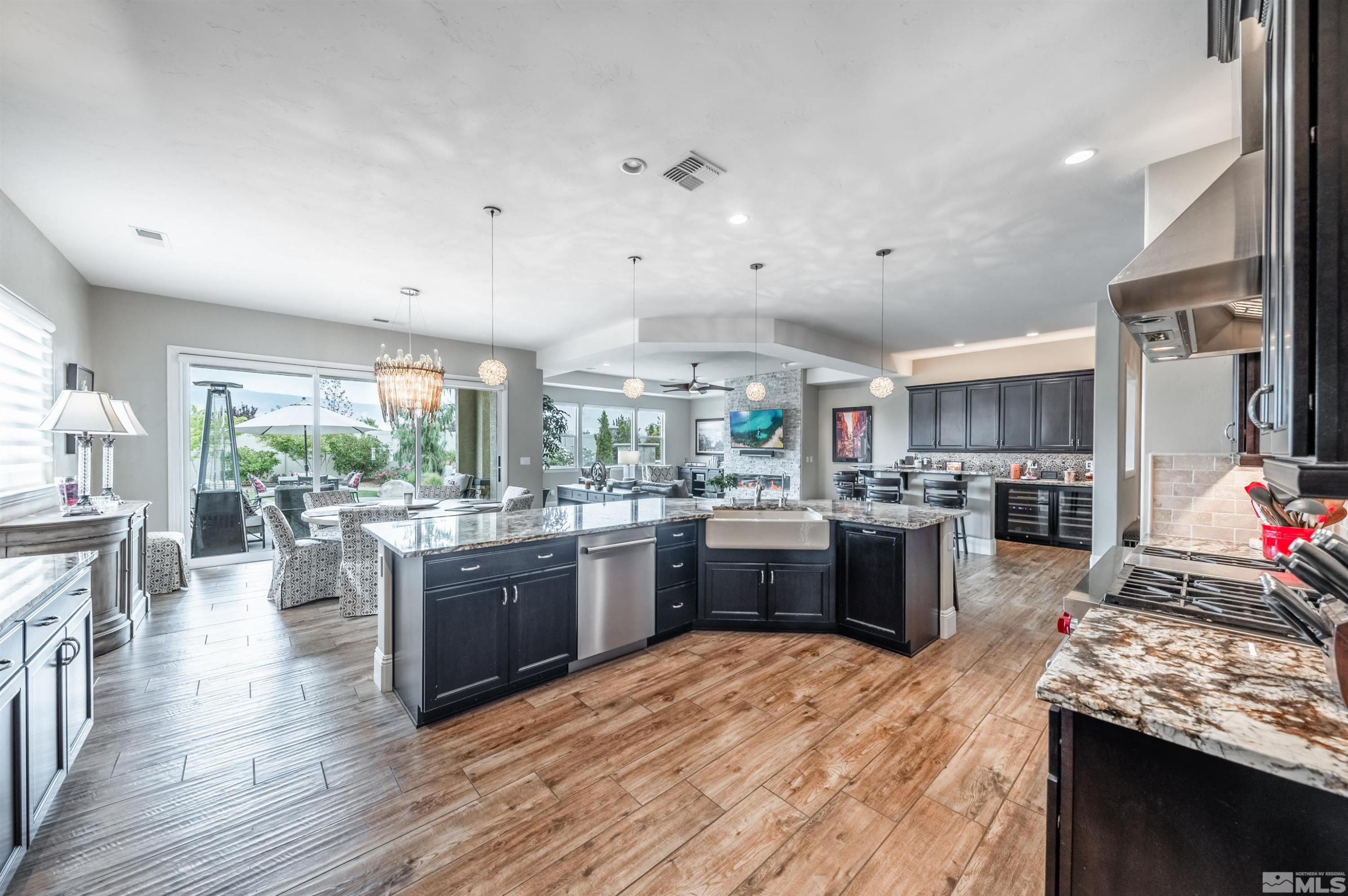 9815 Dyevera Lane Reno, NV 89521 - Photo 12 of 39 a kitchen with lots of counter top space and stainless steel appliances