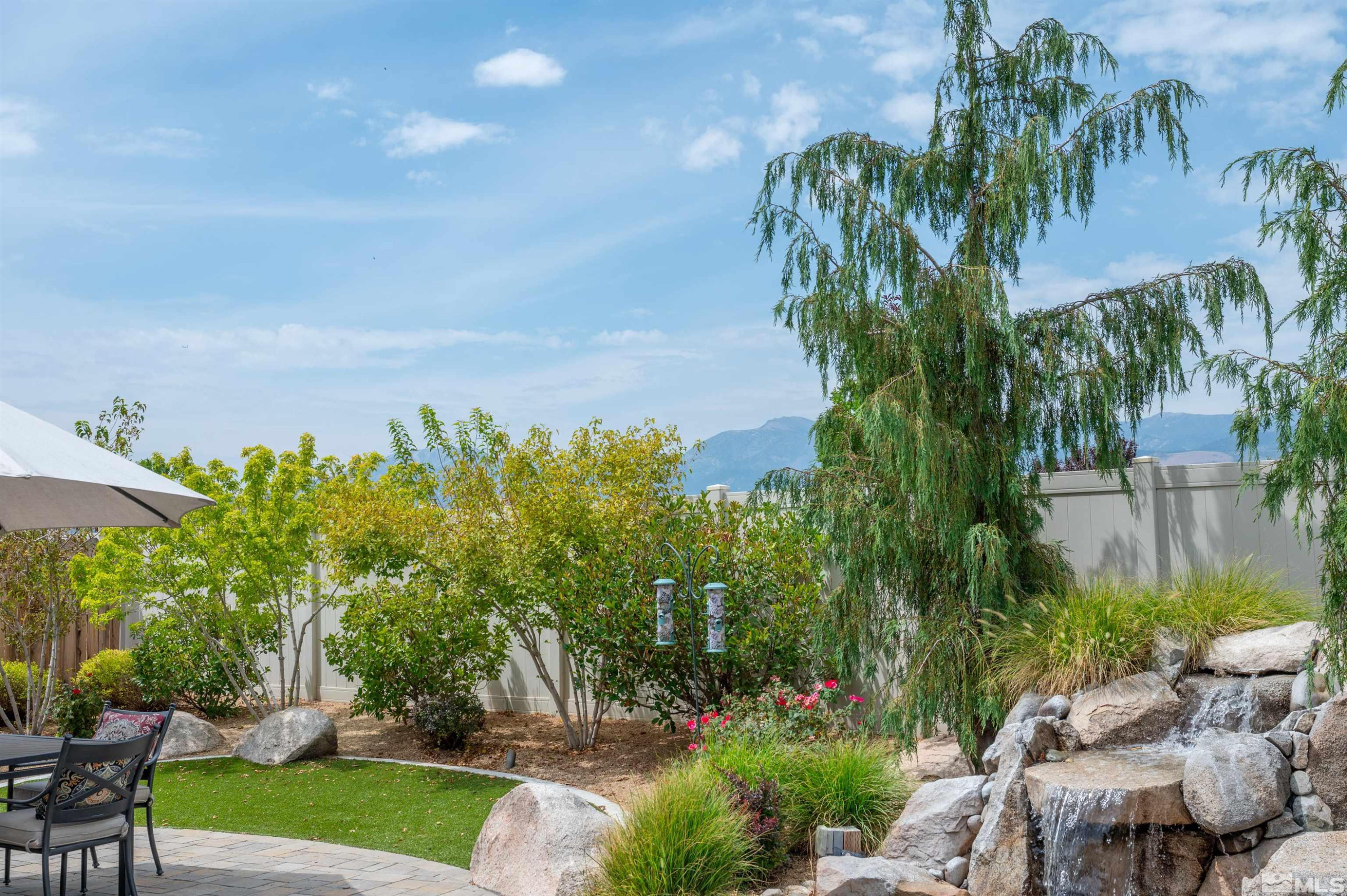 9815 Dyevera Lane Reno, NV 89521 - Photo 15 of 39 a view of a swimming pool with a patio