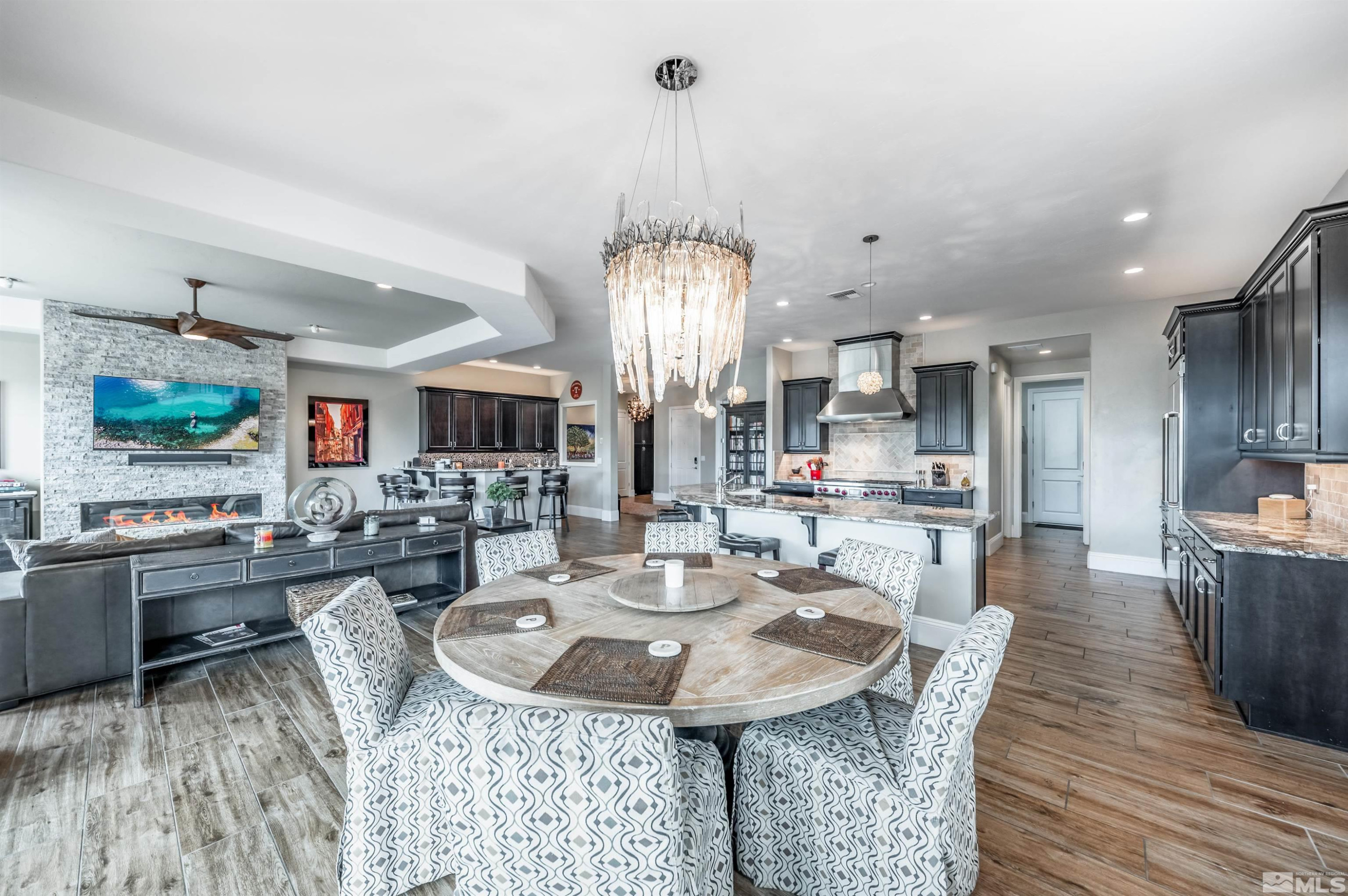 9815 Dyevera Lane Reno, NV 89521 - Photo 18 of 39 a view of a dining room with furniture window and wooden floor