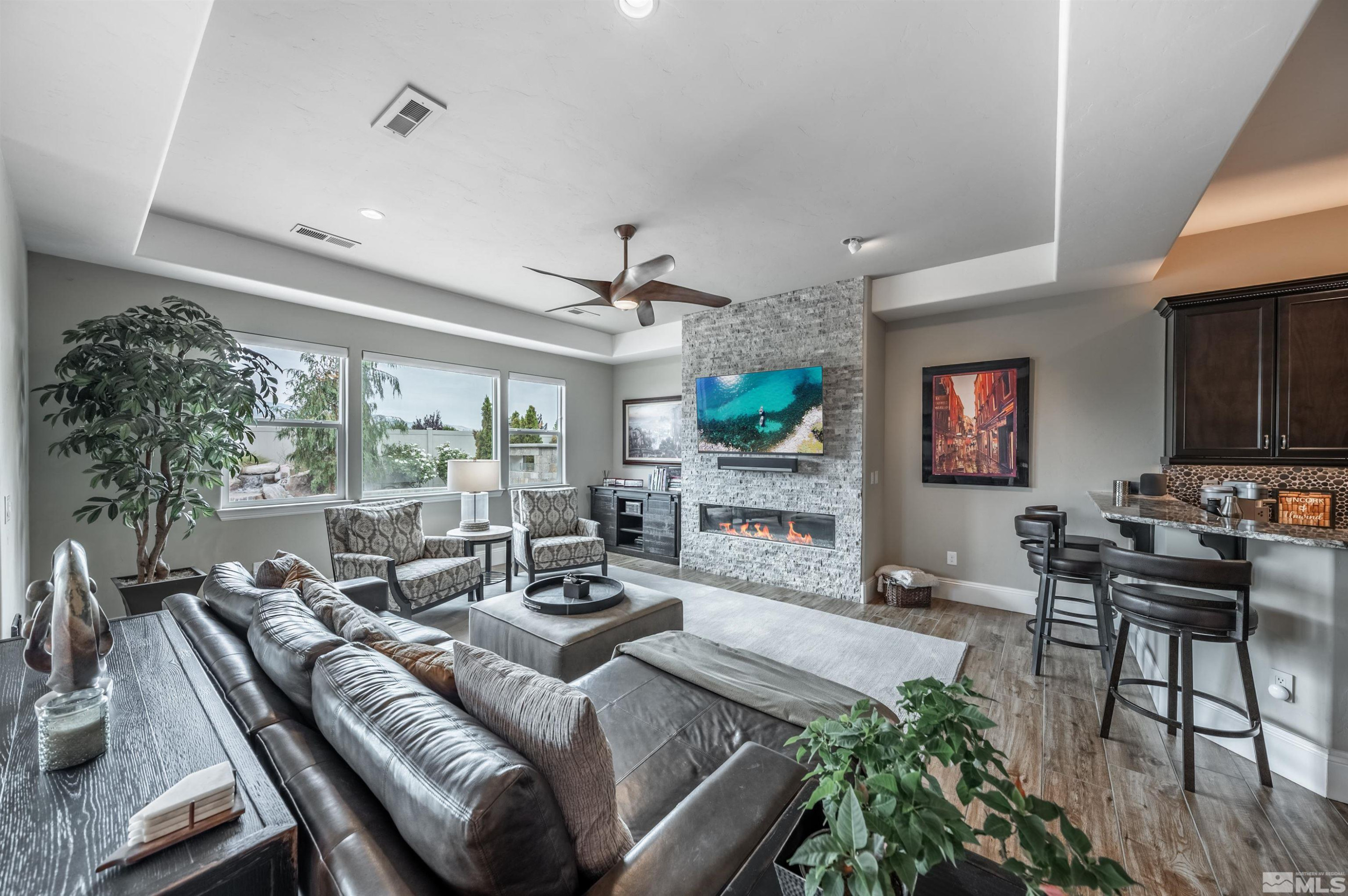 9815 Dyevera Lane Reno, NV 89521 - Photo 20 of 39 a living room with furniture and a flat screen tv