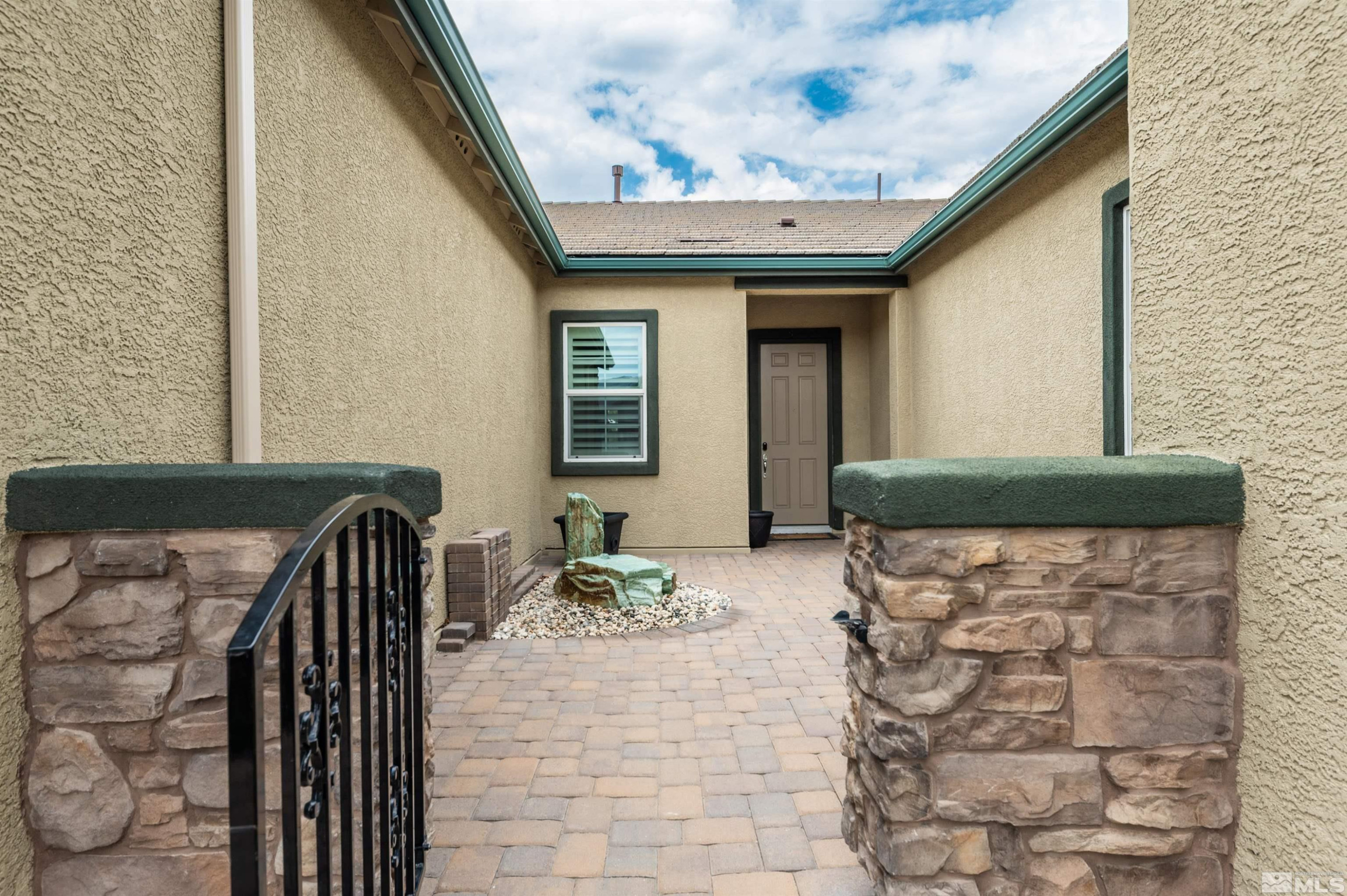 9815 Dyevera Lane Reno, NV 89521 - Photo 2 of 39 a front view of a house with patio