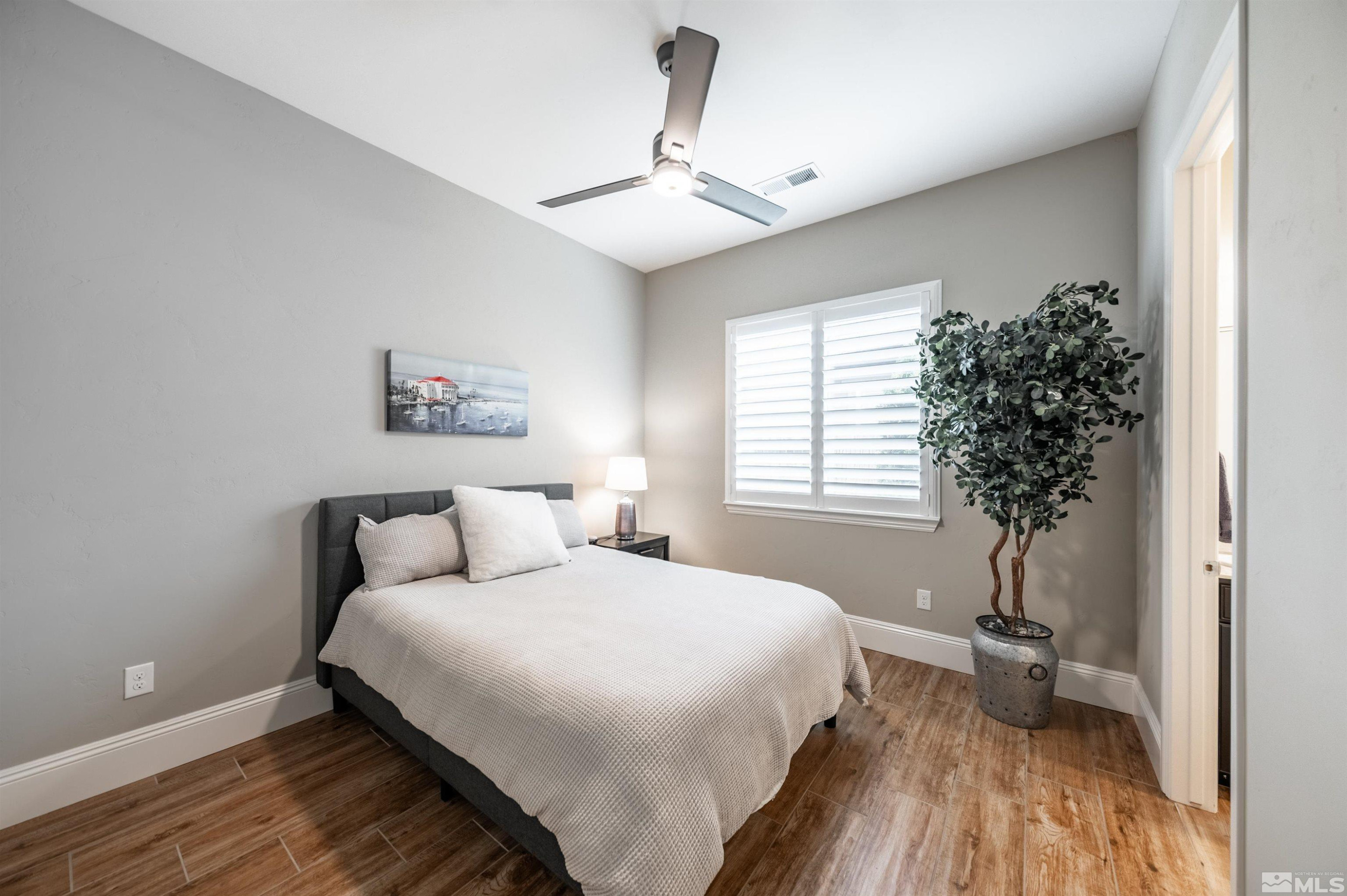9815 Dyevera Lane Reno, NV 89521 - Photo 27 of 39 a bedroom with a bed and a window