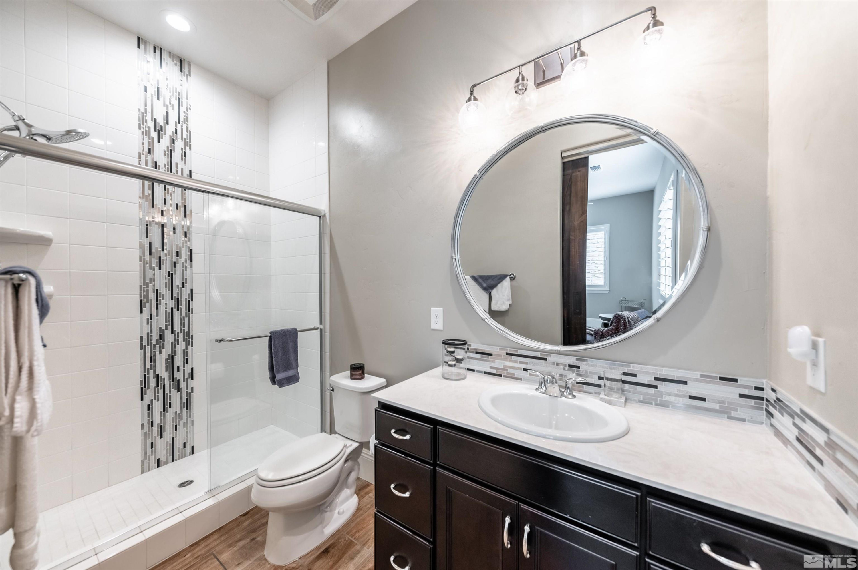 9815 Dyevera Lane Reno, NV 89521 - Photo 30 of 39 a bathroom with a sink toilet and shower