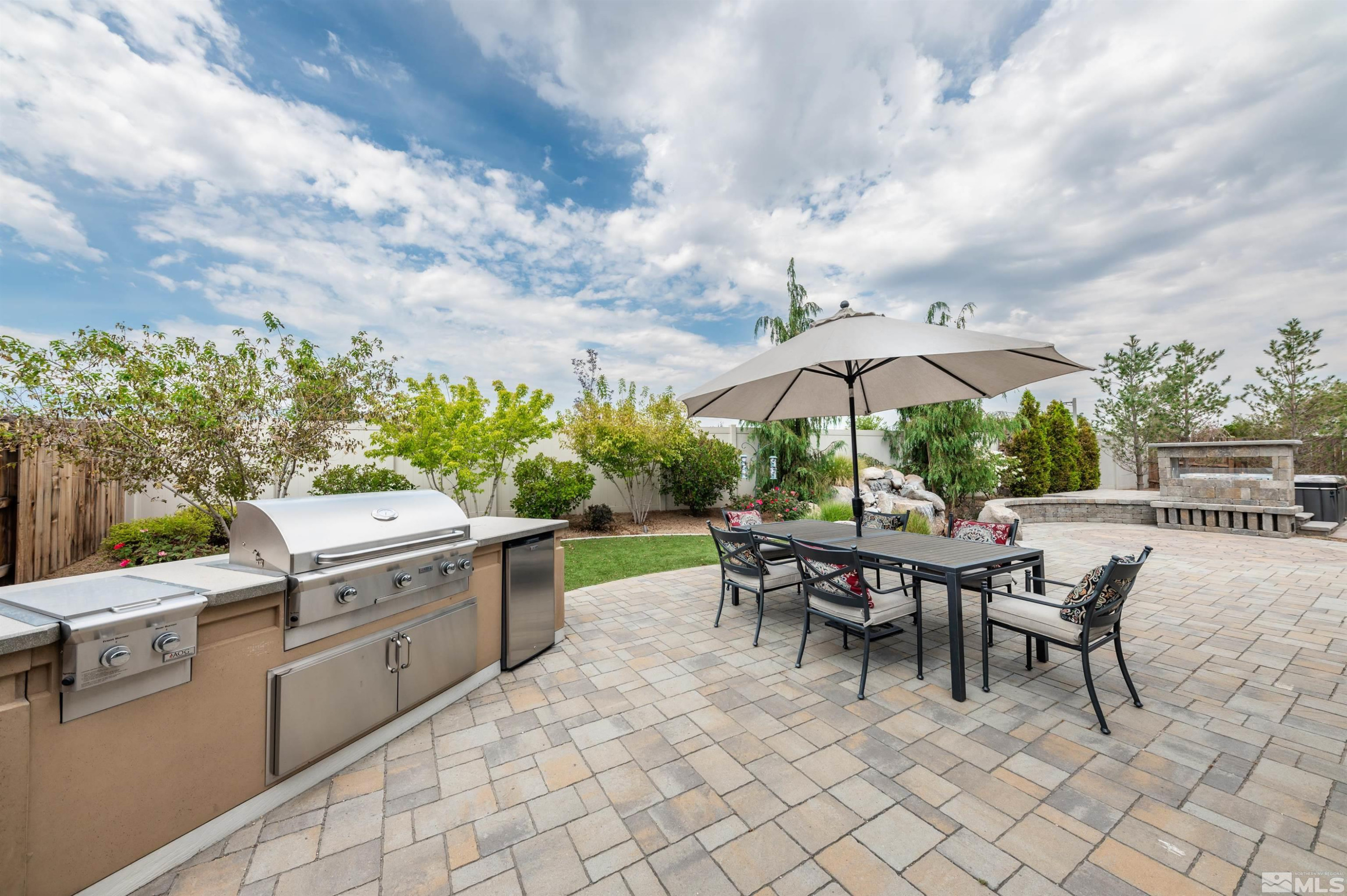 9815 Dyevera Lane Reno, NV 89521 - Photo 33 of 39 an outdoor space with furniture and umbrella
