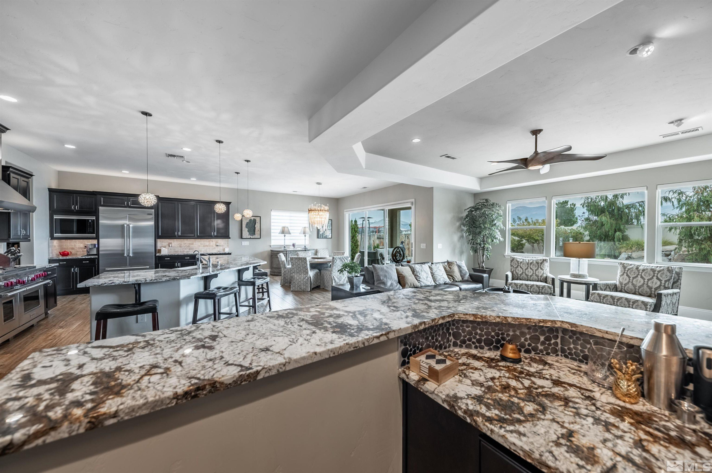 9815 Dyevera Lane Reno, NV 89521 - Photo 6 of 39 a view of a kitchen and dining area