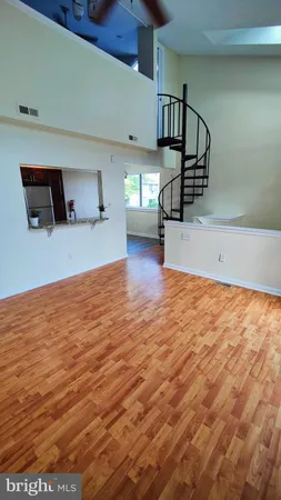 a view of a livingroom with wooden floor