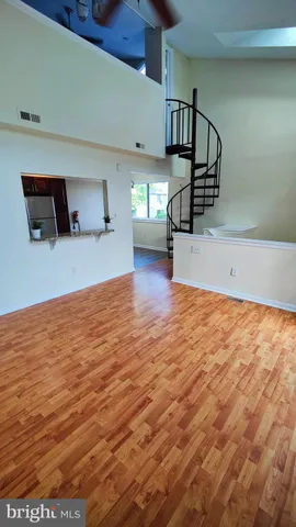 a view of a livingroom with wooden floor