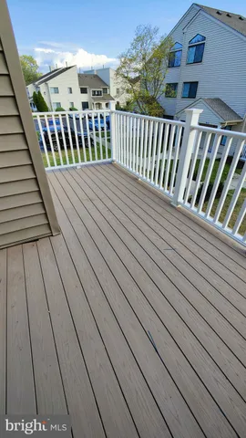 a balcony with wooden floor