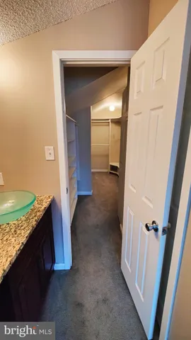 a view of hallway with washer and dryer