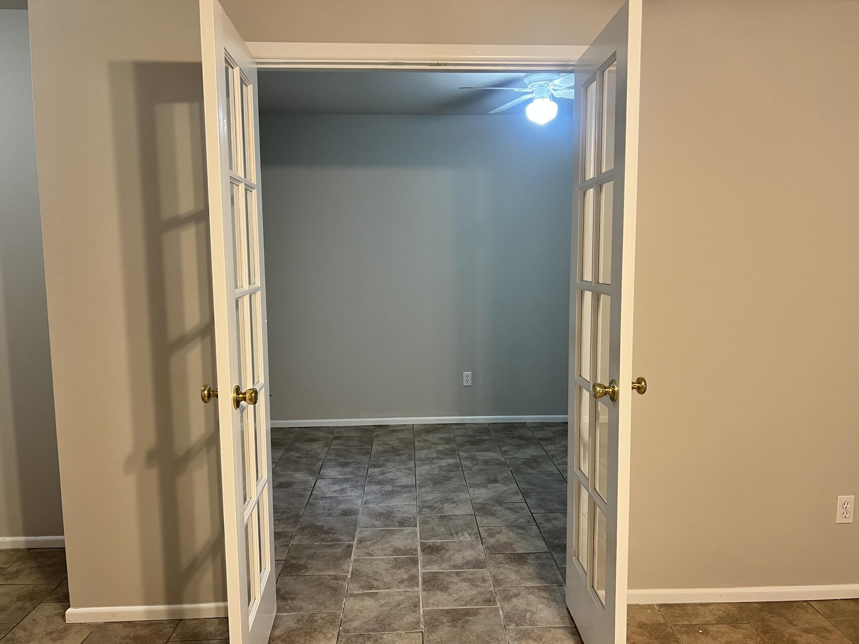 3415 49th Street, Unit B Lubbock, TX 79413 - Photo 15 of 17 a bathroom with a glass shower door