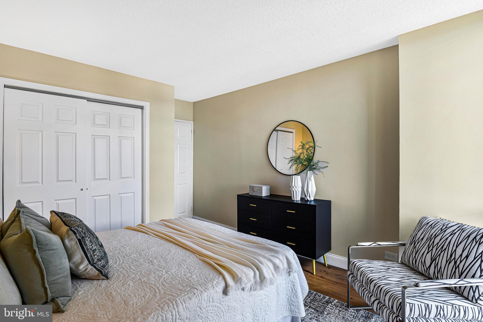 300 M Street Southwest, Unit N508 Washington, DC 20024 - Photo 17 of 32 a bedroom with a bed and a lamp on dresser