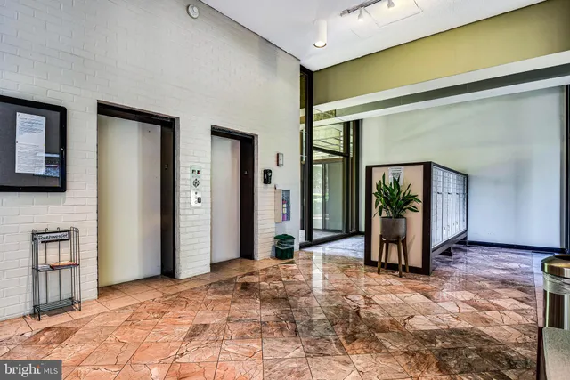 a view of a entryway door of an empty room