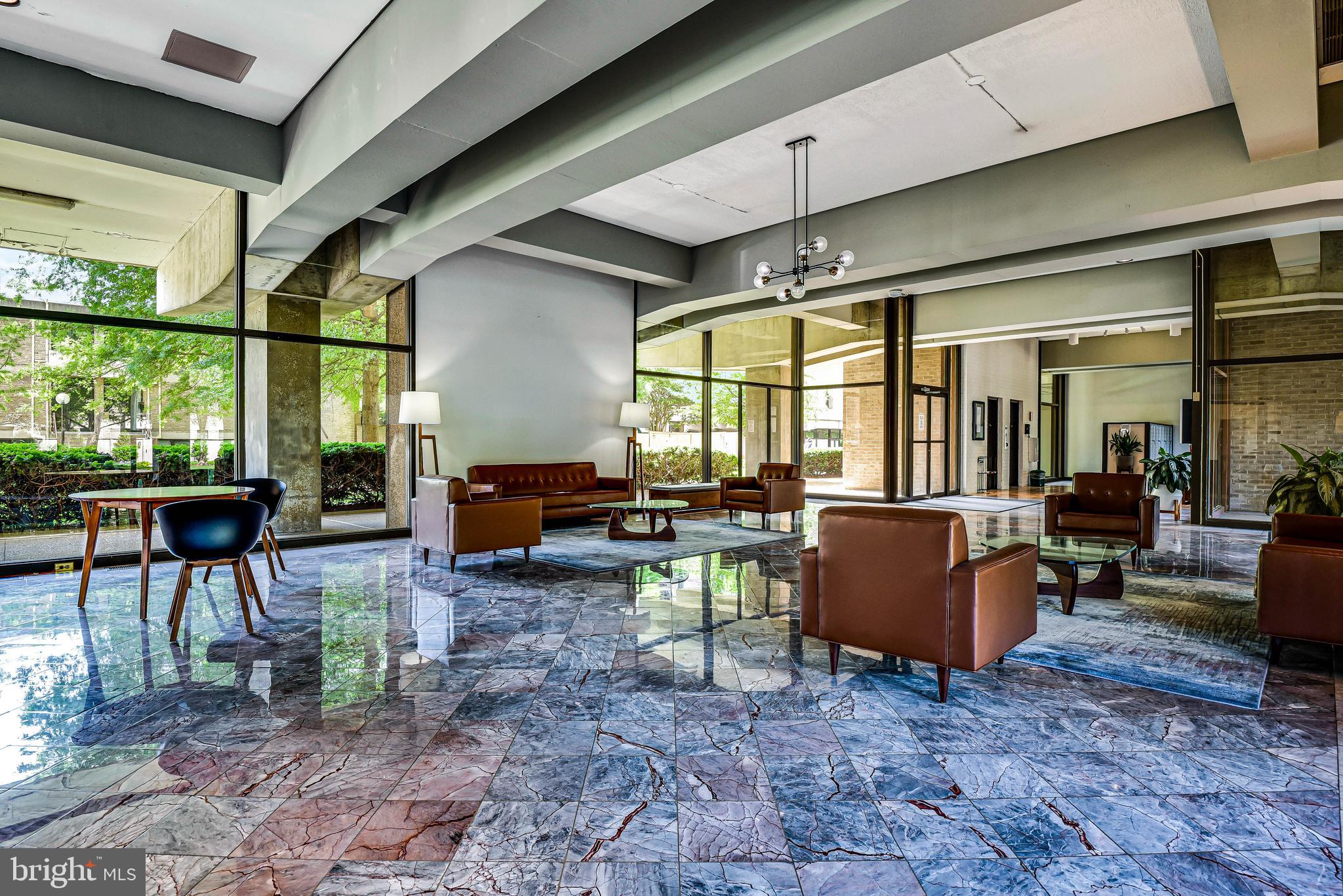 300 M Street Southwest, Unit N508 Washington, DC 20024 - Photo 24 of 32 a living room with furniture a fireplace and large windows
