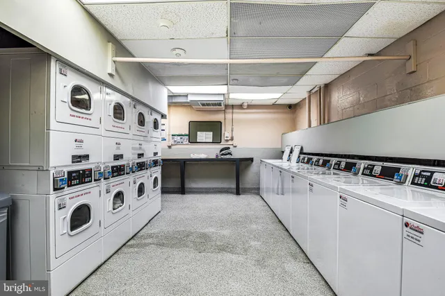 a kitchen with stainless steel appliances granite countertop a sink and a stove