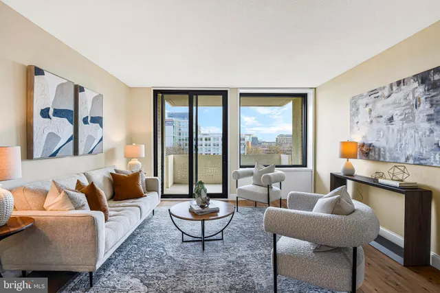 a living room with furniture and a large window