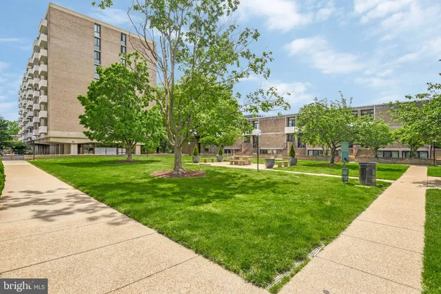 a view of a building with a yard