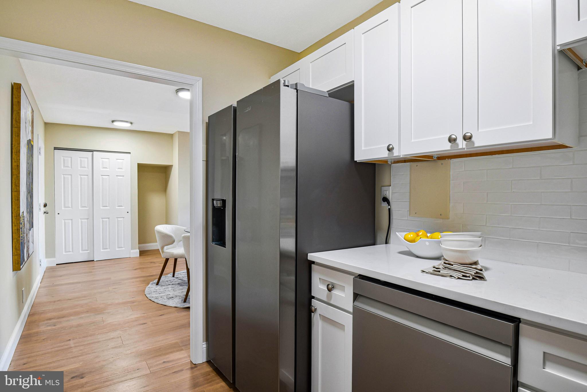 300 M Street Southwest, Unit N508 Washington, DC 20024 - Photo 10 of 32 a kitchen with a refrigerator and a sink