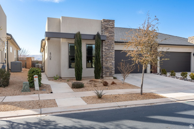 4708 Martin Drive St. George, UT 84790 - Photo 2 of 28 Contemporary home with driveway, stucco siding, and an attached garage