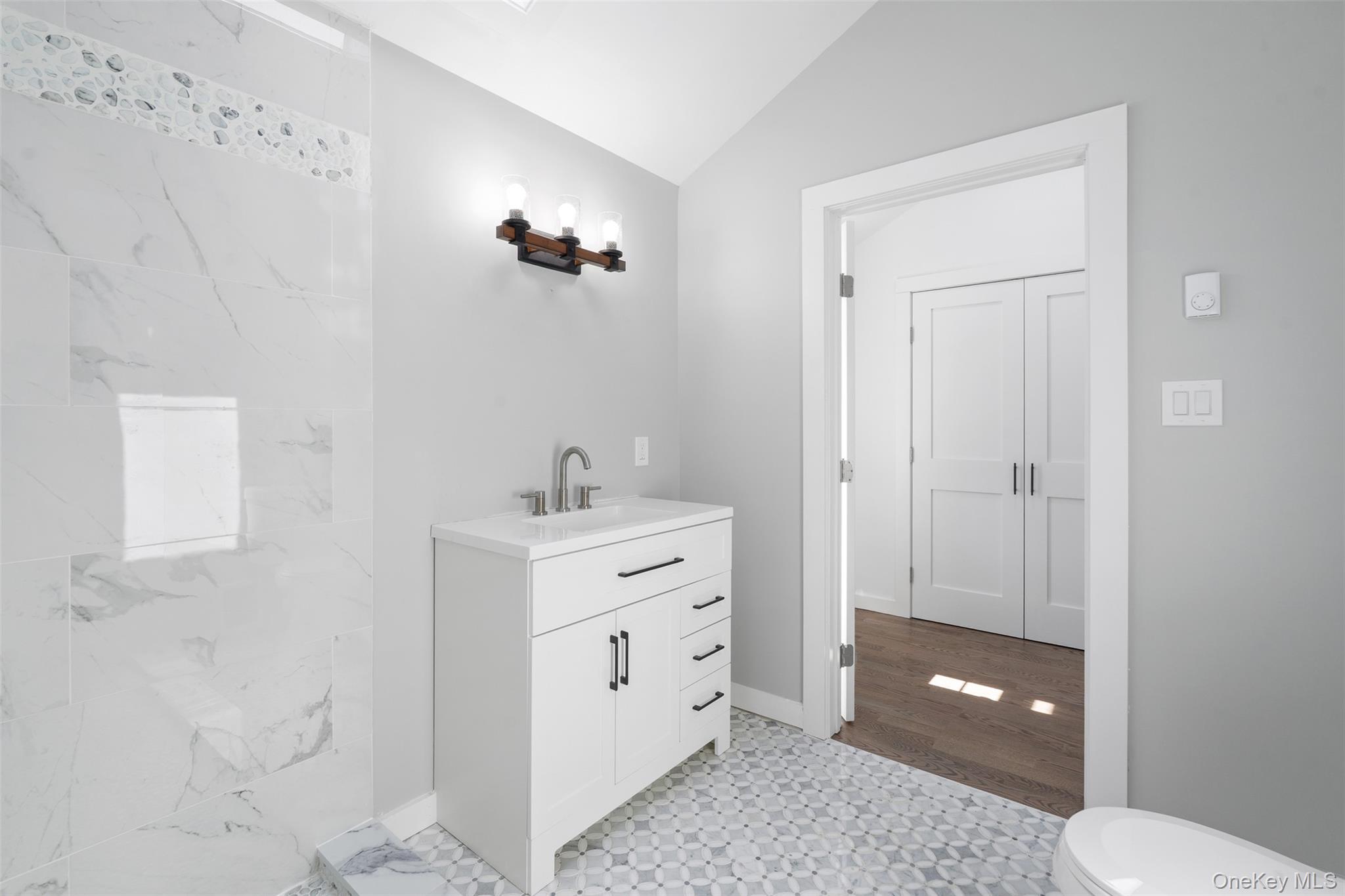70 Barmore Road LaGrangeville, NY 12540 - Photo 20 of 47 Bathroom featuring vanity and lofted ceiling