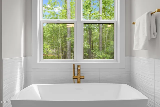 a bathroom with a toilet sink vanity and mirror