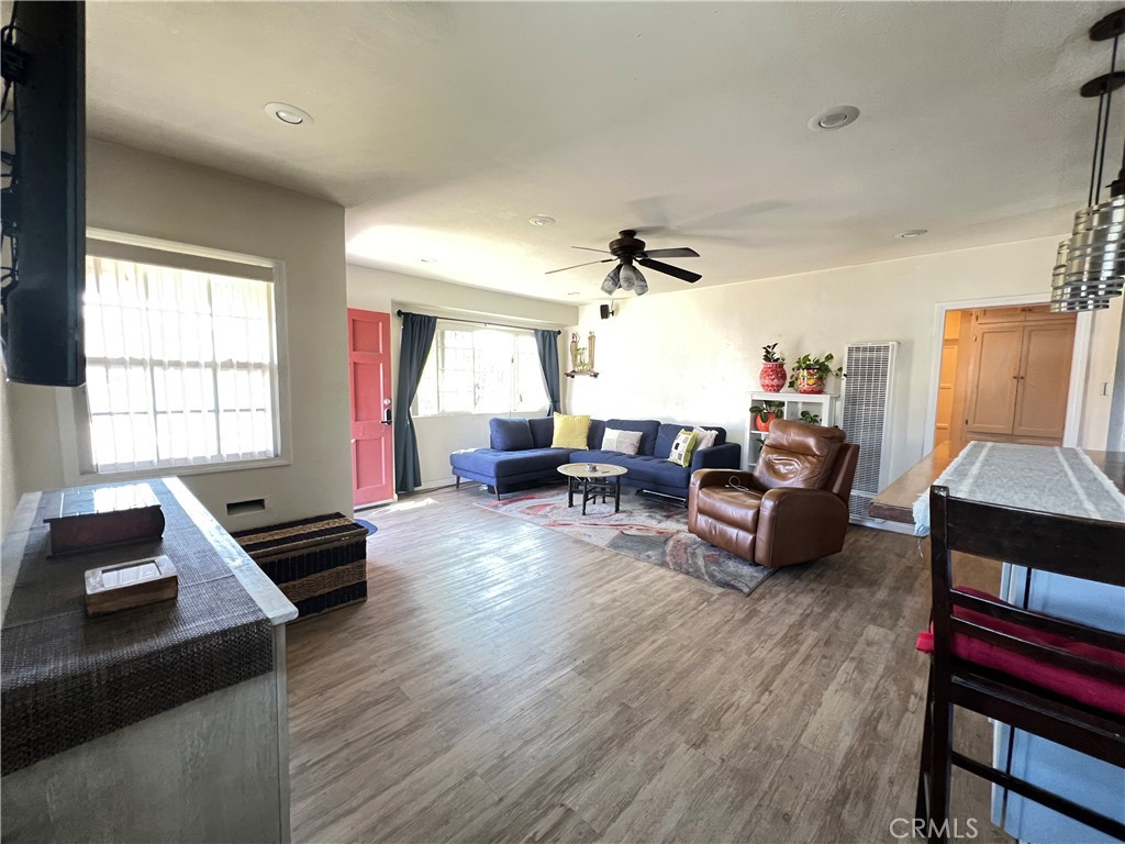 10709 Wheelock Circle Whittier, CA 90606 - Photo 16 of 34 a living room with furniture and wooden floor