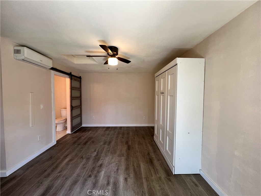 10709 Wheelock Circle Whittier, CA 90606 - Photo 2 of 34 a view of empty room with wooden floor and fan