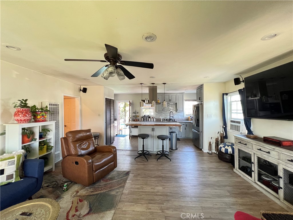 10709 Wheelock Circle Whittier, CA 90606 - Photo 22 of 34 a living room with furniture and a flat screen tv