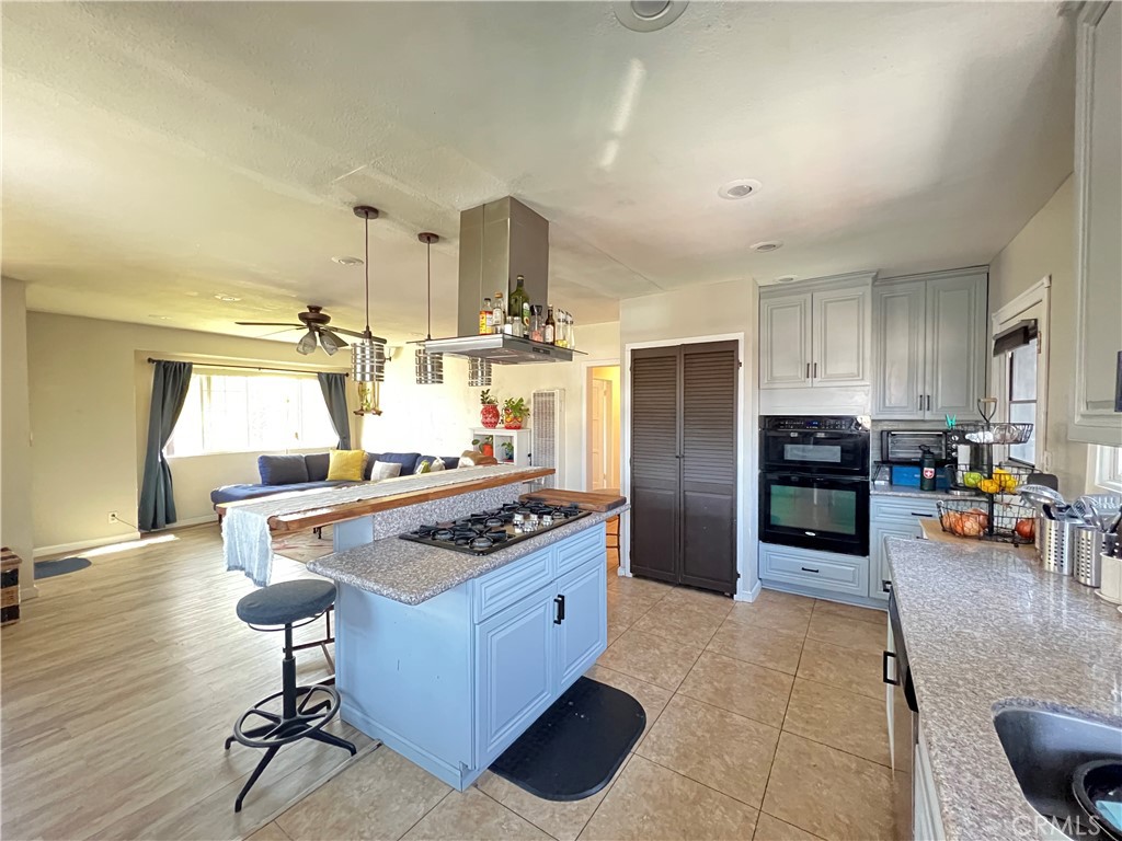 10709 Wheelock Circle Whittier, CA 90606 - Photo 26 of 34 a kitchen with stainless steel appliances granite countertop a stove and a refrigerator