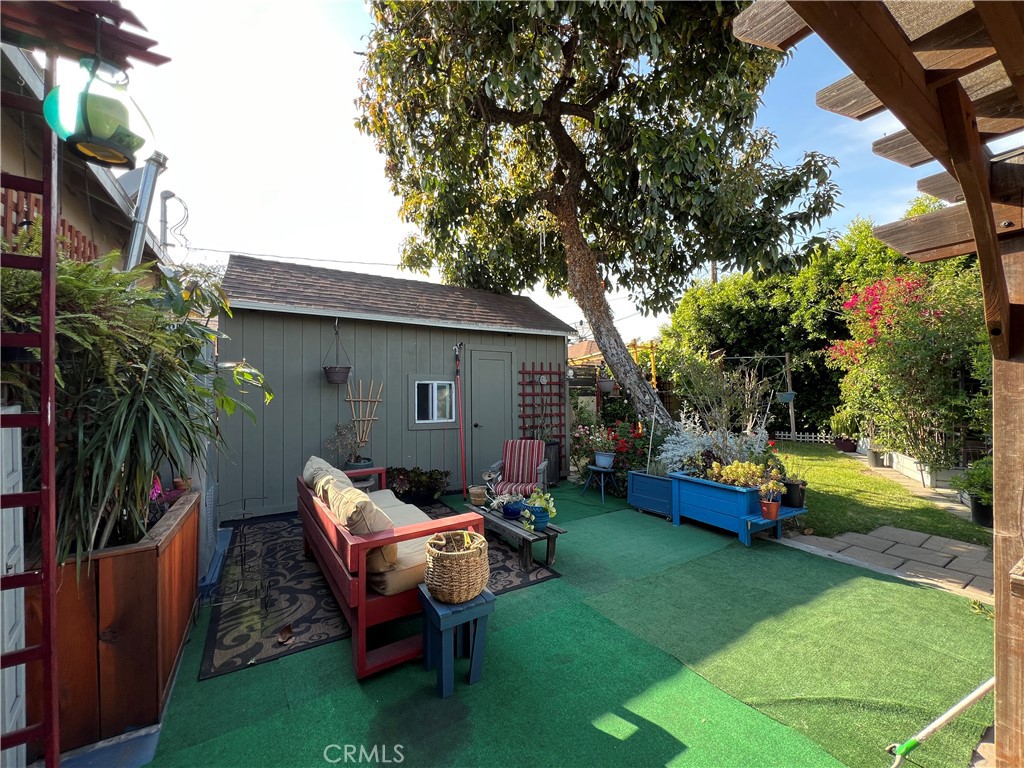 10709 Wheelock Circle Whittier, CA 90606 - Photo 27 of 34 a view of a house with backyard sitting area and garden