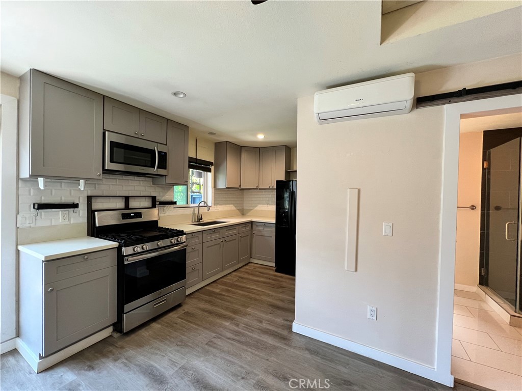 10709 Wheelock Circle Whittier, CA 90606 - Photo 3 of 34 a kitchen with stainless steel appliances granite countertop a refrigerator stove and sink