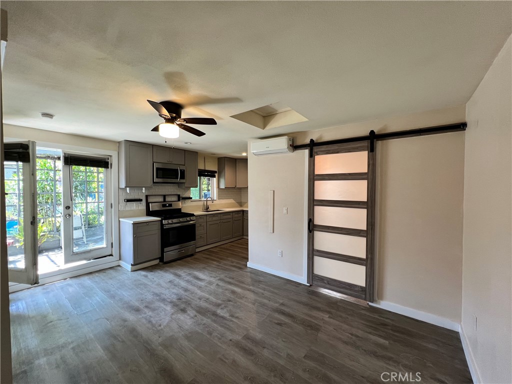10709 Wheelock Circle Whittier, CA 90606 - Photo 5 of 34 a kitchen with stainless steel appliances kitchen island granite countertop a refrigerator and a stove top oven