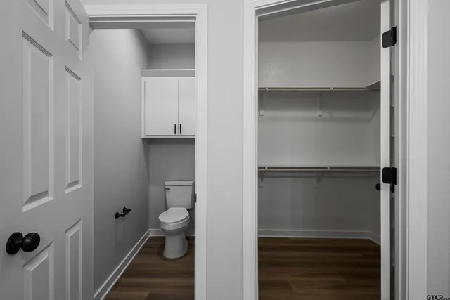 a view of room with window and wooden floor