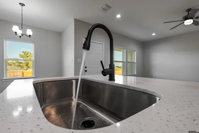 an aerial view of a house with a swimming pool