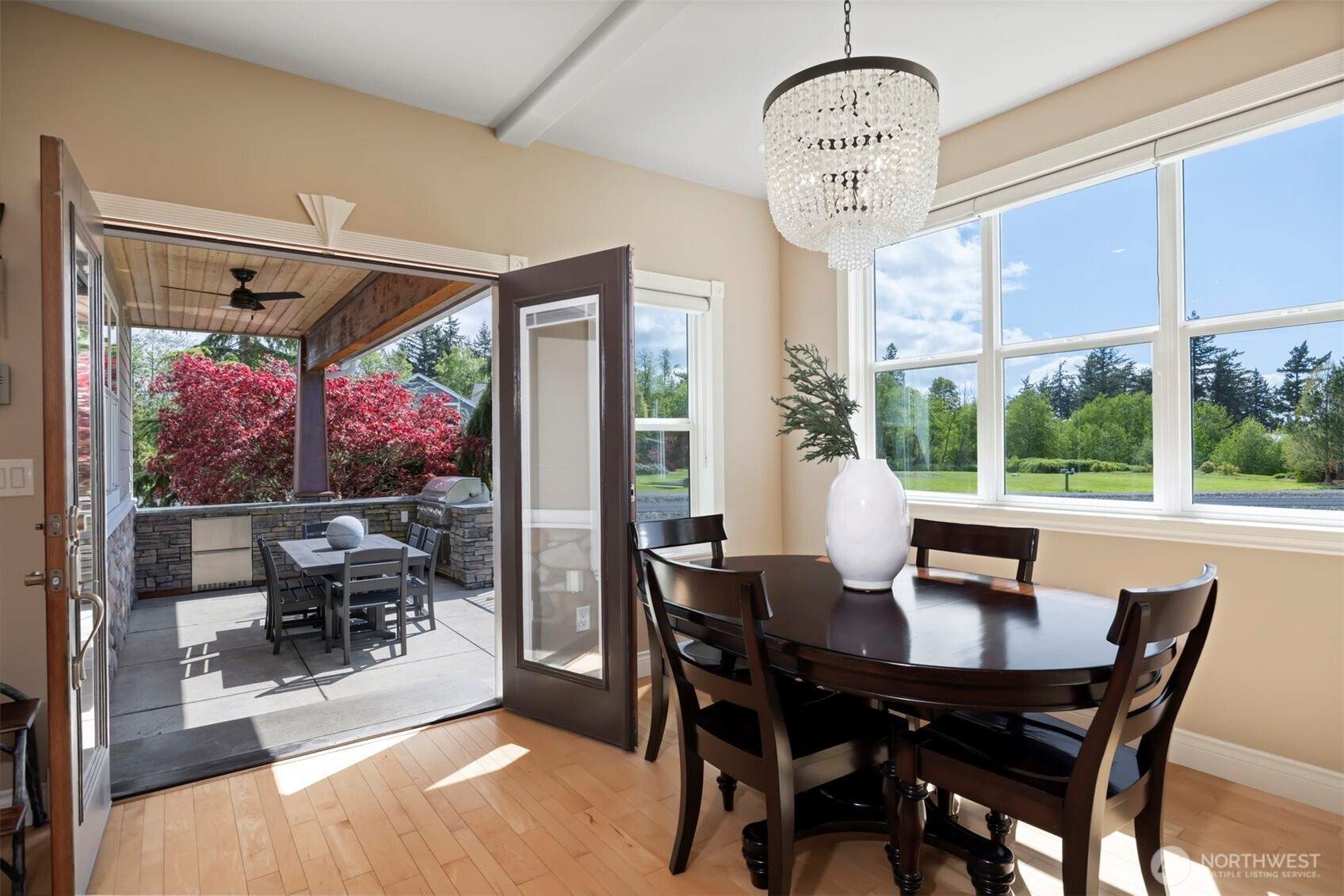 6152 Garrett Lane Ferndale, WA 98248 - Photo 18 of 40 a view of a dining room with furniture wooden floor and a chandelier