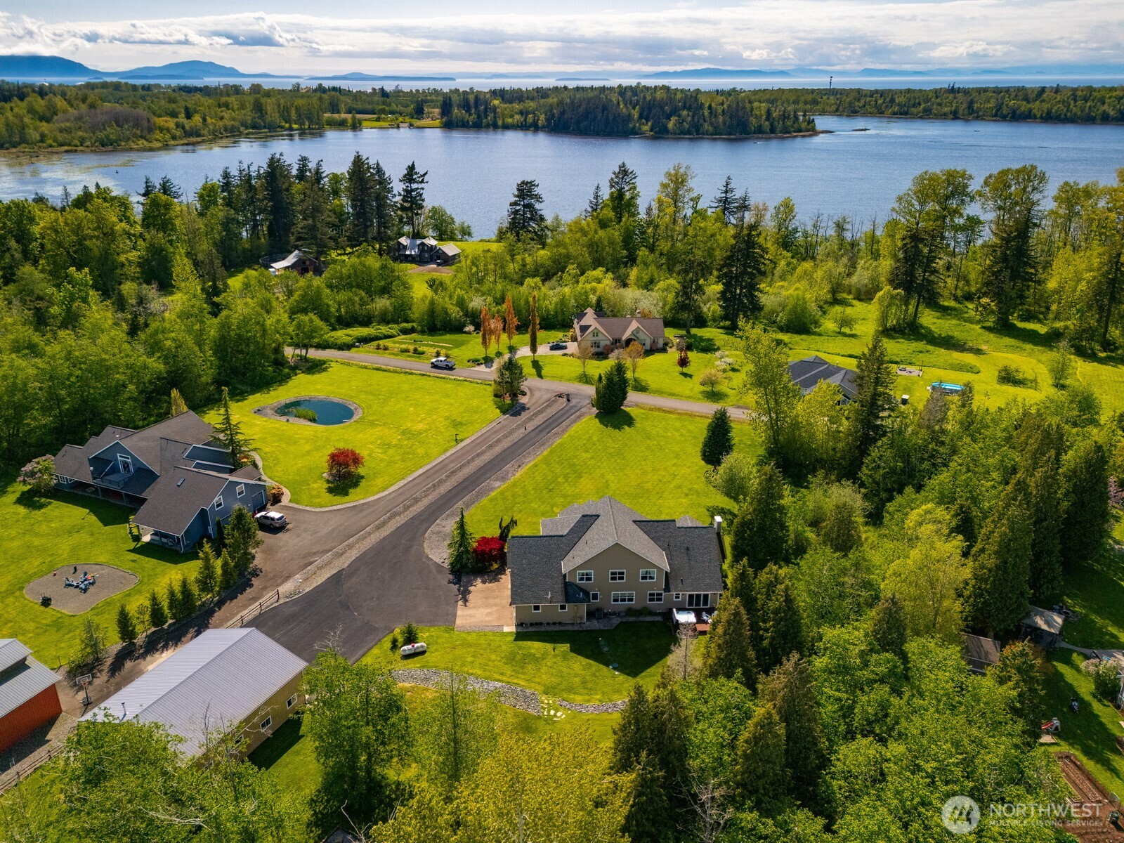 6152 Garrett Lane Ferndale, WA 98248 - Photo 2 of 40 an aerial view of a house with a lake view