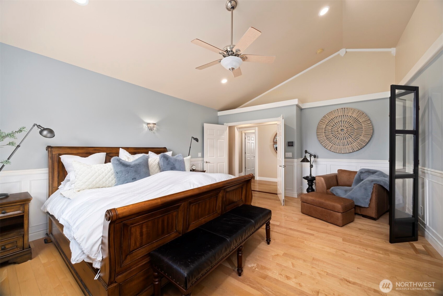 6152 Garrett Lane Ferndale, WA 98248 - Photo 24 of 40 a bed room with a bed couch and a chandelier