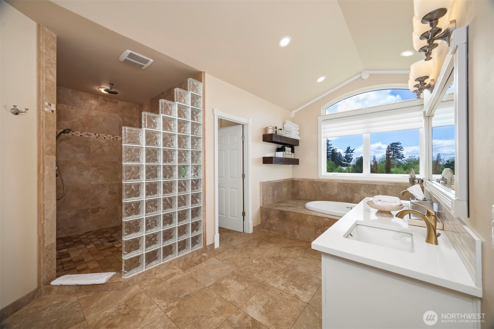 6152 Garrett Lane Ferndale, WA 98248 - Photo 25 of 40 a bathroom with a shower sink and mirror