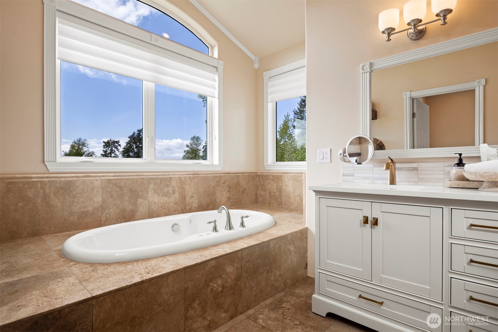 6152 Garrett Lane Ferndale, WA 98248 - Photo 26 of 40 a bathroom with a tub sink and mirror